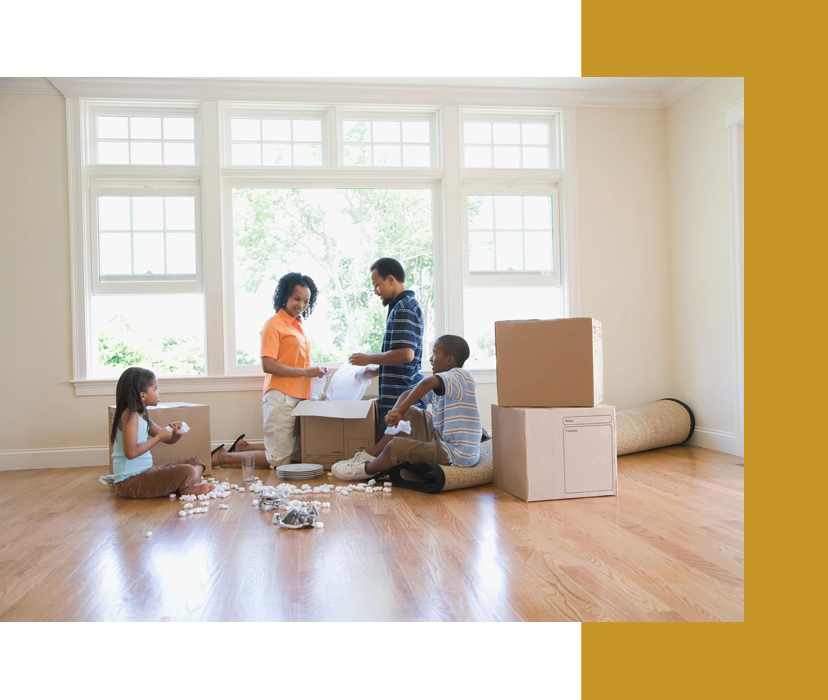 A group of people in a room with boxes.